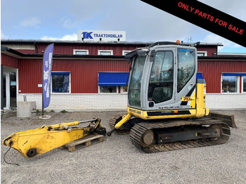 Pásové rýpadlo NEW HOLLAND
