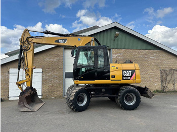 Kolesové rýpadlo CATERPILLAR M313D