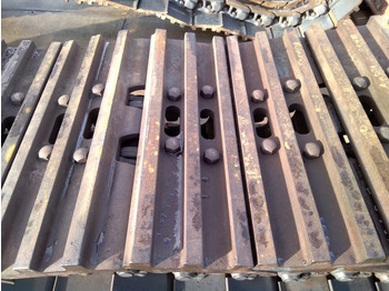 Díly pásových podvozků NEW HOLLAND