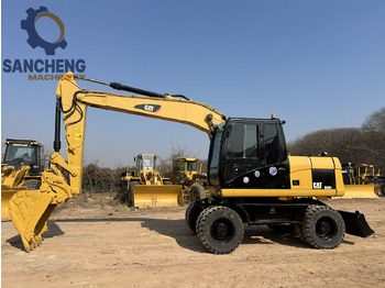 Kolesové rýpadlo CATERPILLAR M320