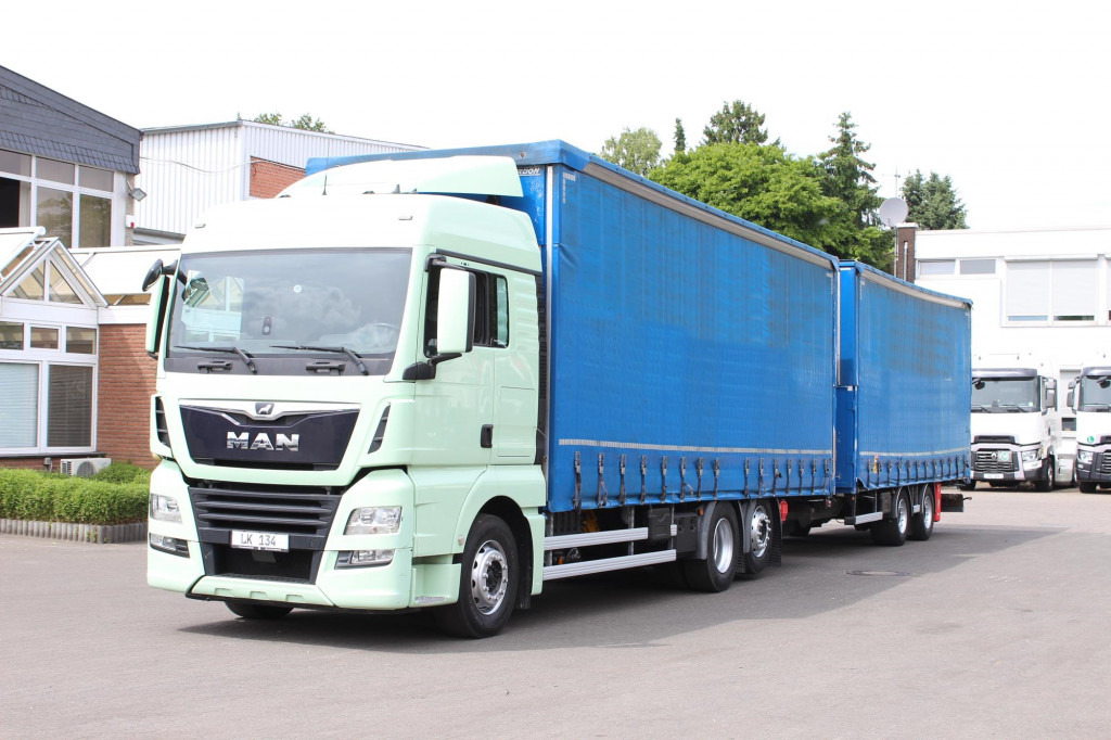 MAN TGX 26.460 Retarder Jumbo-Zug 120M3 Durchlade - Plachtový nákladní auto: obrázek 1 MAN TGX 26.460 Retarder Jumbo-Zug 120M3 Durchlade - Plachtový nákladní auto: obrázek 1