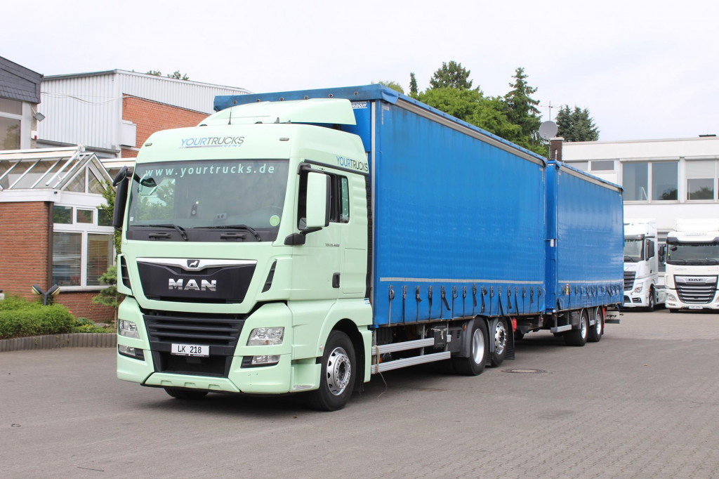 MAN TGX 26.460 Retarder Jumbo-Zug 120M3 Durchlade - Plachtový nákladní auto: obrázek 1 MAN TGX 26.460 Retarder Jumbo-Zug 120M3 Durchlade - Plachtový nákladní auto: obrázek 1
