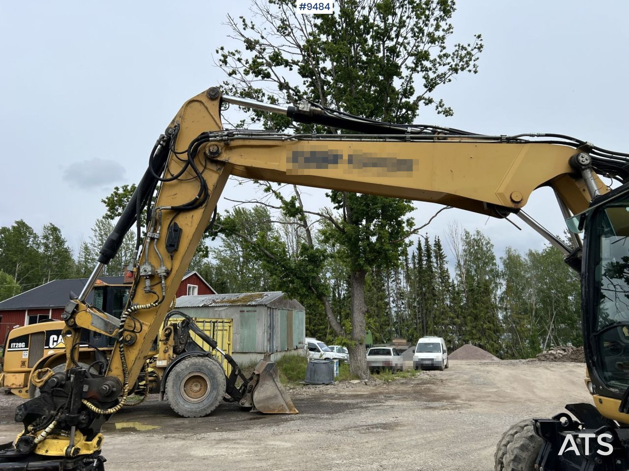 Kolesové rýpadlo CAT M313D with tipping wagon and attachments (VIDEO): obrázek 13