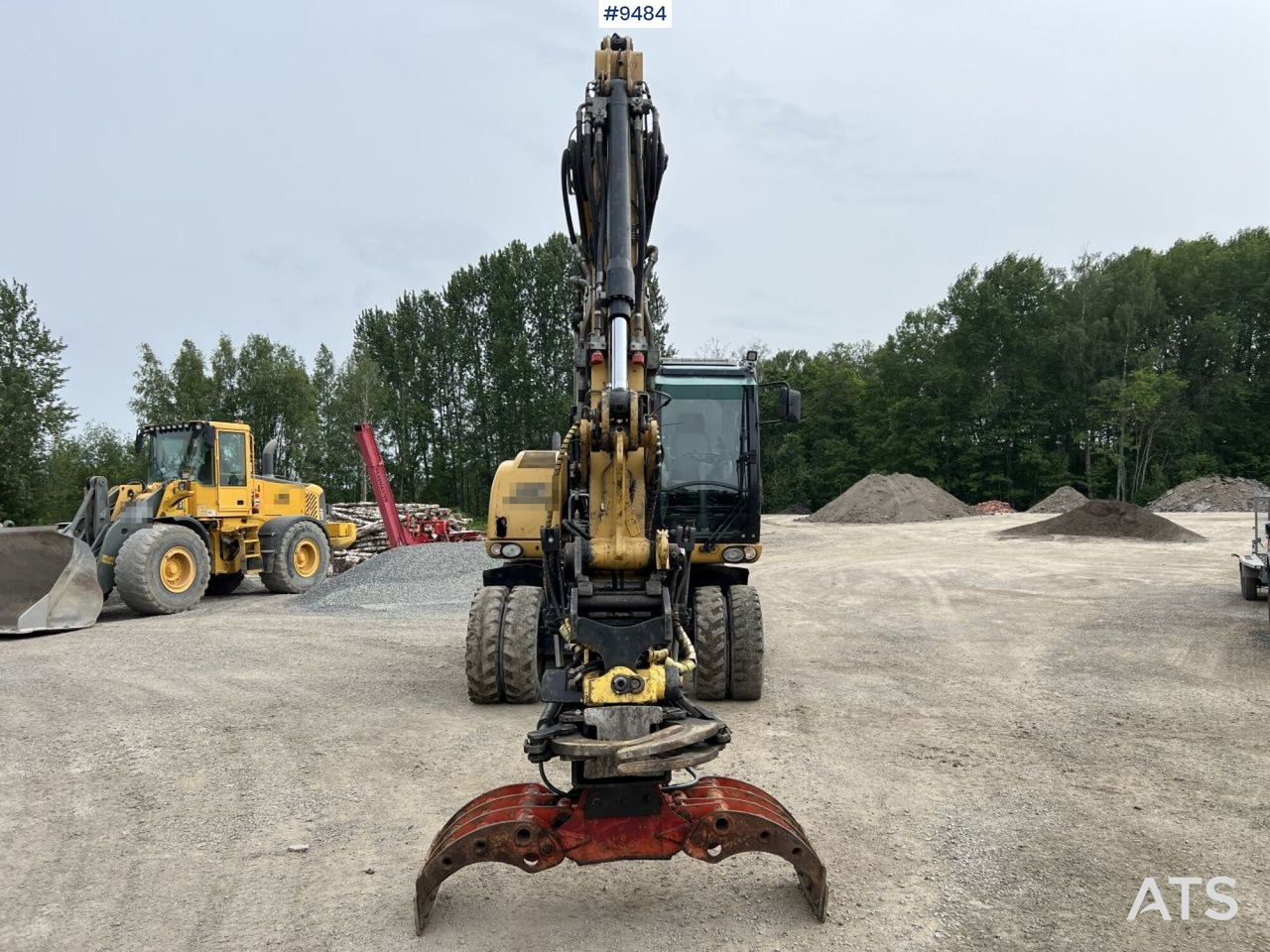 Kolesové rýpadlo CAT M313D with tipping wagon and attachments (VIDEO): obrázek 12