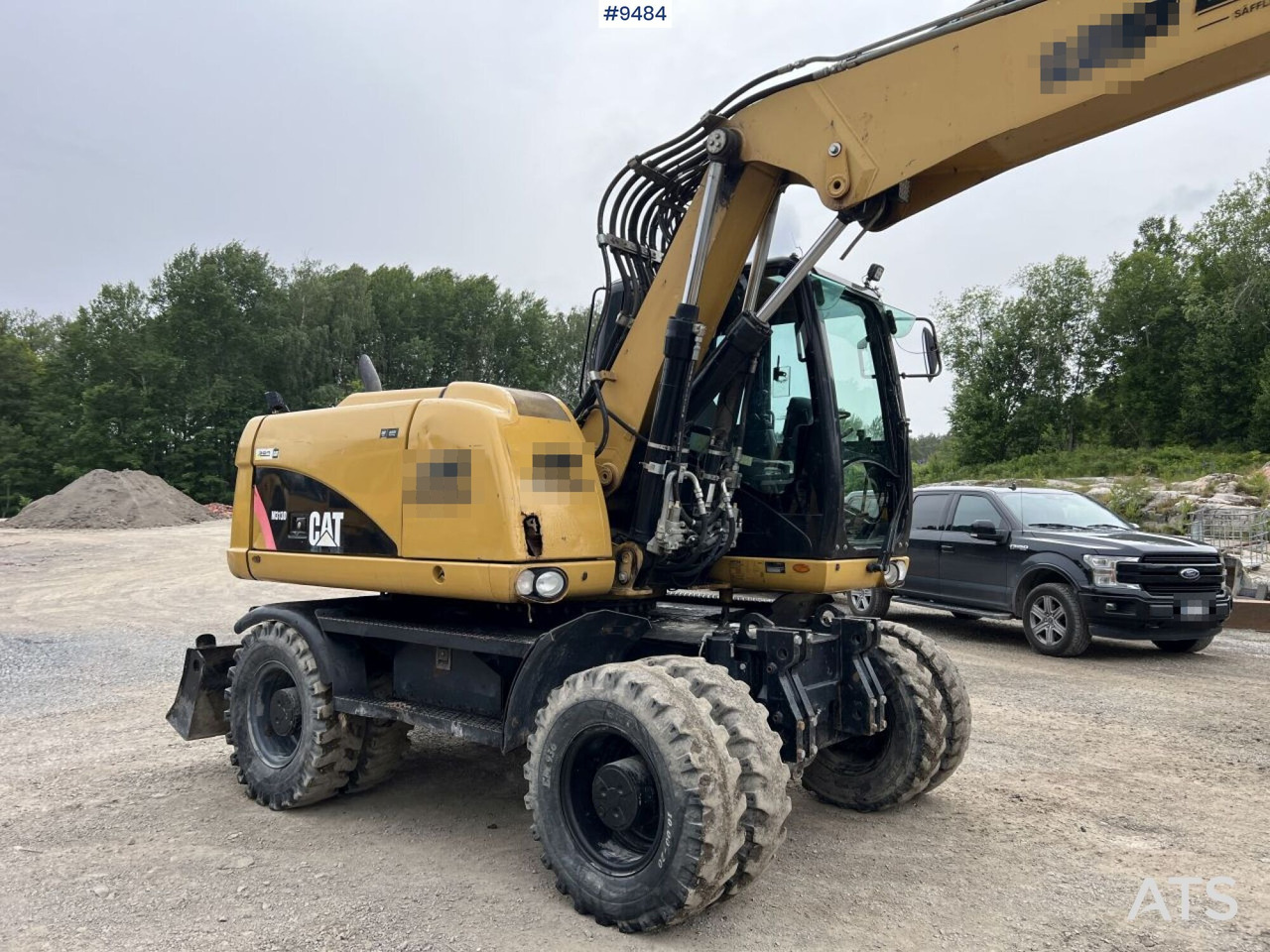 Kolesové rýpadlo CAT M313D with tipping wagon and attachments (VIDEO): obrázek 11