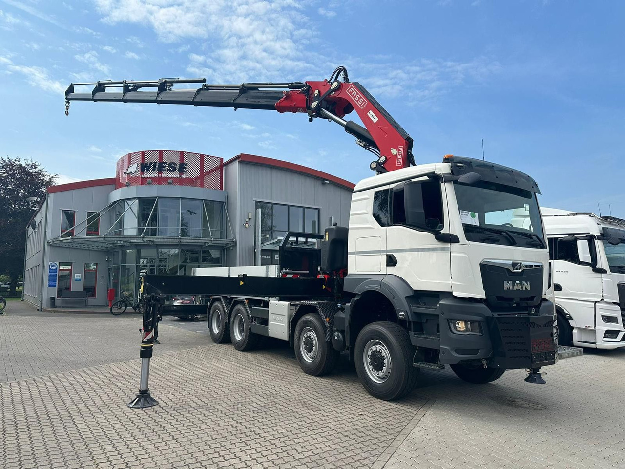 MAN TGS 41.520 8x8 mit Fassi Ladekran F710RA.2.26 - Nákladní automobil valníkový/ Plošinový: obrázek 1 MAN TGS 41.520 8x8 mit Fassi Ladekran F710RA.2.26 - Nákladní automobil valníkový/ Plošinový: obrázek 1