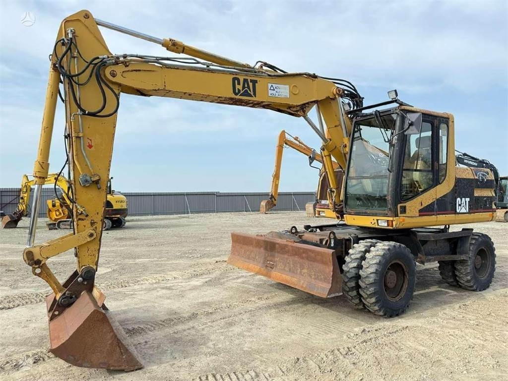 CAT M 312, SCANDINAVIAN - Kolesové rýpadlo: obrázek 1 CAT M 312, SCANDINAVIAN - Kolesové rýpadlo: obrázek 1