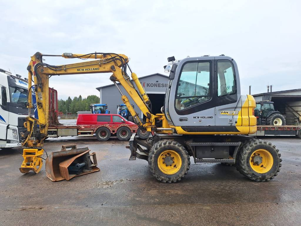 Kolesové rýpadlo New Holland MH2.6 PYÖRITTÄJÄLLÄ: obrázek 1
