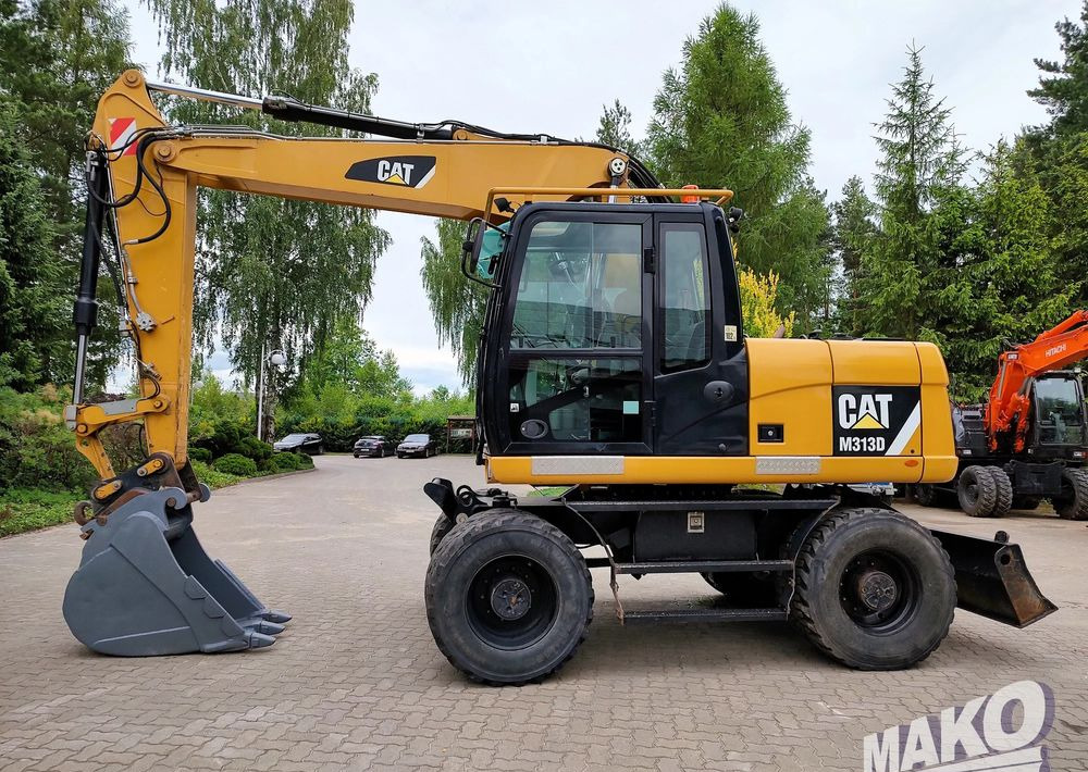 Caterpillar M313D - Kolesové rýpadlo: obrázek 1 Caterpillar M313D - Kolesové rýpadlo: obrázek 1