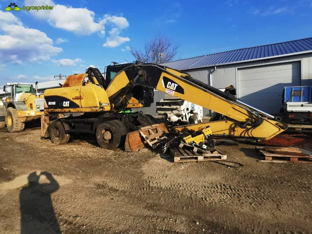 CAT M 318 D - Překládkové rypadlo: obrázek 1 CAT M 318 D - Překládkové rypadlo: obrázek 1
