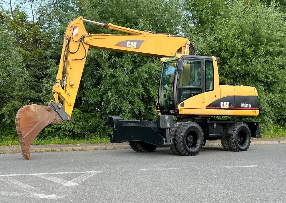 Caterpillar CAT M315C CATERPILLAR SPROWADZONY Bardzo Dobry Stan - Kolesové rýpadlo: obrázek 1 Caterpillar CAT M315C CATERPILLAR SPROWADZONY Bardzo Dobry Stan - Kolesové rýpadlo: obrázek 1