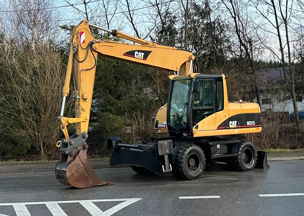 Caterpillar CAT M315C CATERPILLAR SPROWADZONY Bardzo Dobry Stan - Kolesové rýpadlo: obrázek 1 Caterpillar CAT M315C CATERPILLAR SPROWADZONY Bardzo Dobry Stan - Kolesové rýpadlo: obrázek 1