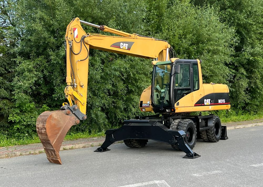 Caterpillar CAT M315C CATERPILLAR SPROWADZONY Bardzo Dobry Stan - Kolesové rýpadlo: obrázek 1 Caterpillar CAT M315C CATERPILLAR SPROWADZONY Bardzo Dobry Stan - Kolesové rýpadlo: obrázek 1