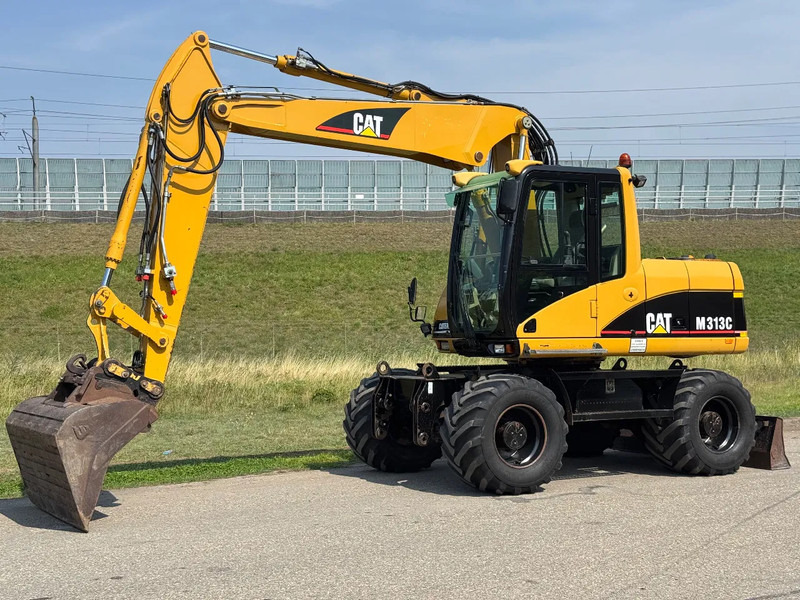 Caterpillar M313C - Kolesové rýpadlo: obrázek 1 Caterpillar M313C - Kolesové rýpadlo: obrázek 1