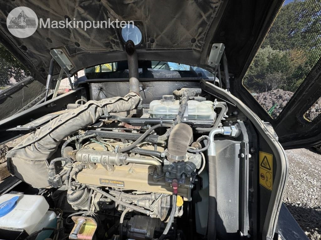 Kolový nakladač JCB 409: obrázek 6