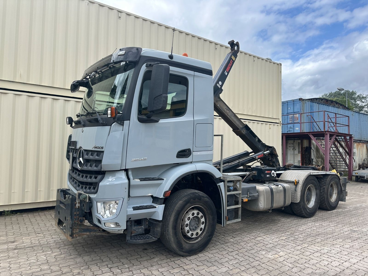 Mercedes-Benz Arocs 2643/Hiab M. /1. Hd /R.St. 3.90m/265.773KM - Hákový nosič kontejnerů: obrázek 1 Mercedes-Benz Arocs 2643/Hiab M. /1. Hd /R.St. 3.90m/265.773KM - Hákový nosič kontejnerů: obrázek 1