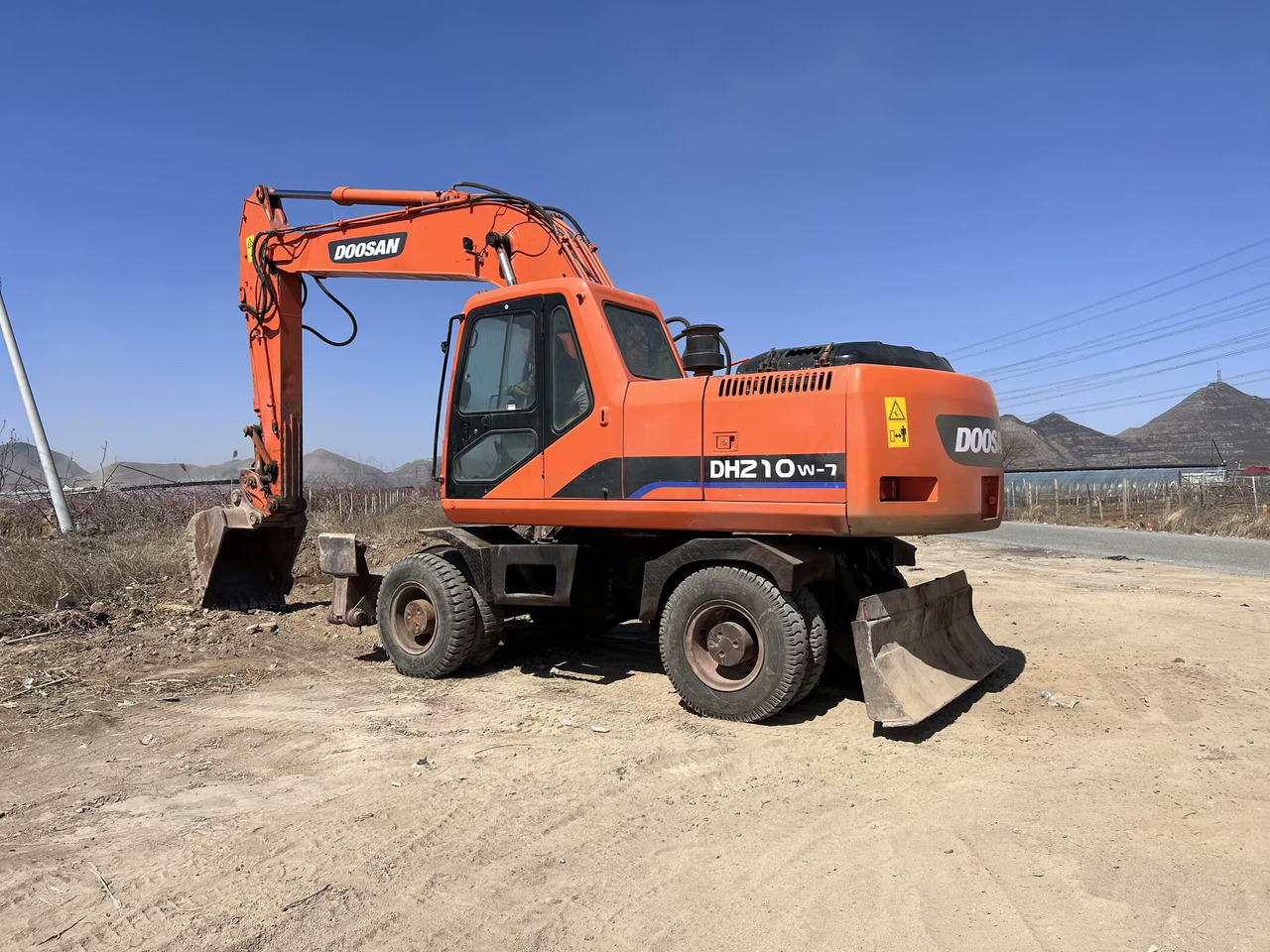 DOOSAN 210w-7 - Kolesové rýpadlo: obrázek 1 DOOSAN 210w-7 - Kolesové rýpadlo: obrázek 1