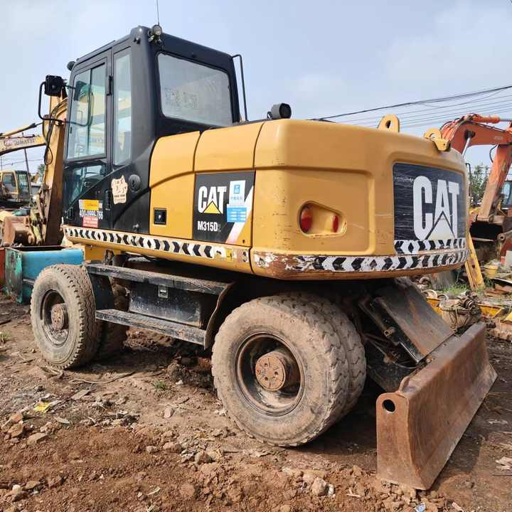 Used Digger Cat 315 Construction Machinery Construction Digger Used Cat 315 Cheap Excavator - Kolesové rýpadlo: obrázek 1 Used Digger Cat 315 Construction Machinery Construction Digger Used Cat 315 Cheap Excavator - Kolesové rýpadlo: obrázek 1