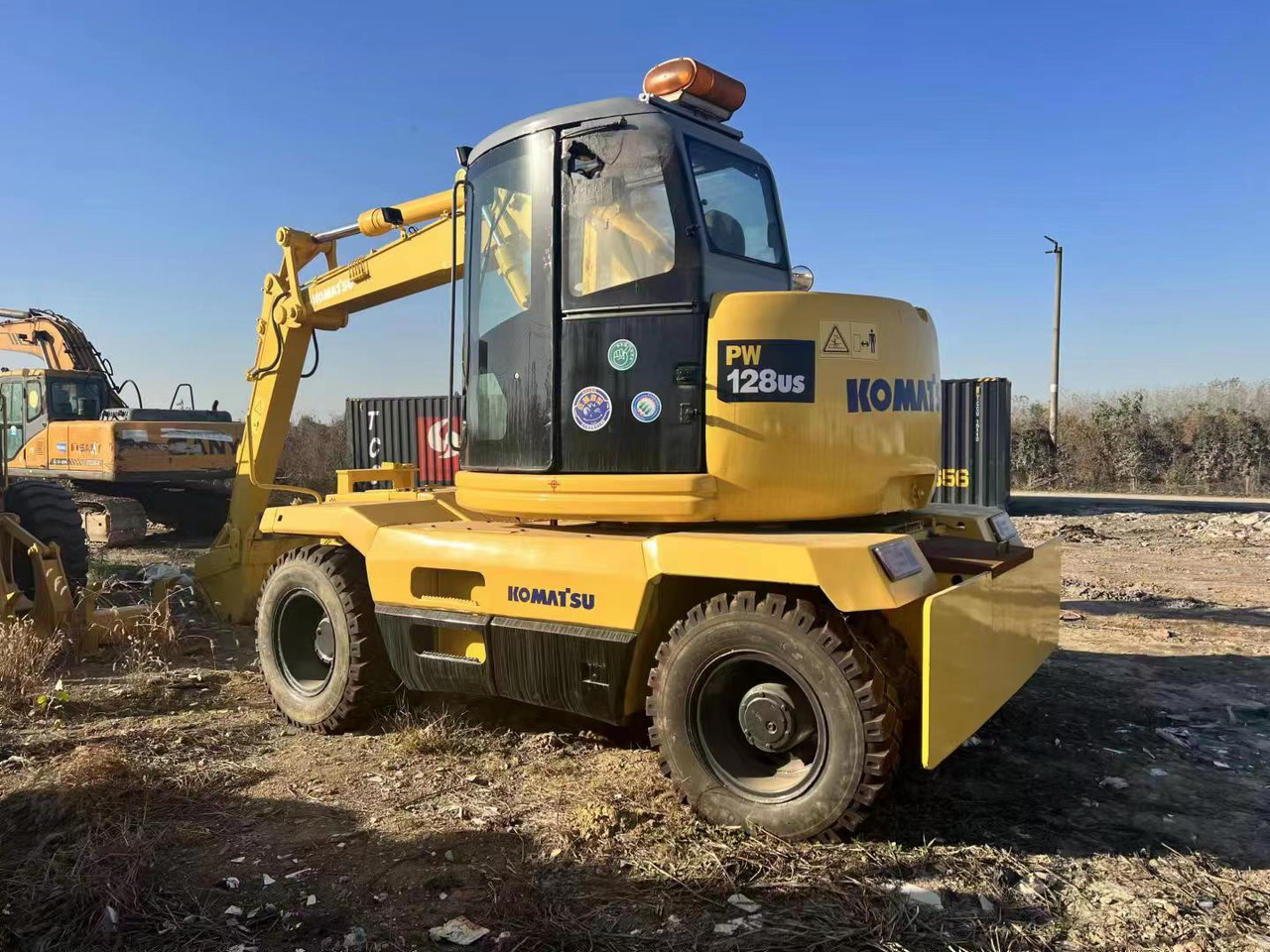 KOMATSU PC128US - Kolesové rýpadlo: obrázek 1 KOMATSU PC128US - Kolesové rýpadlo: obrázek 1