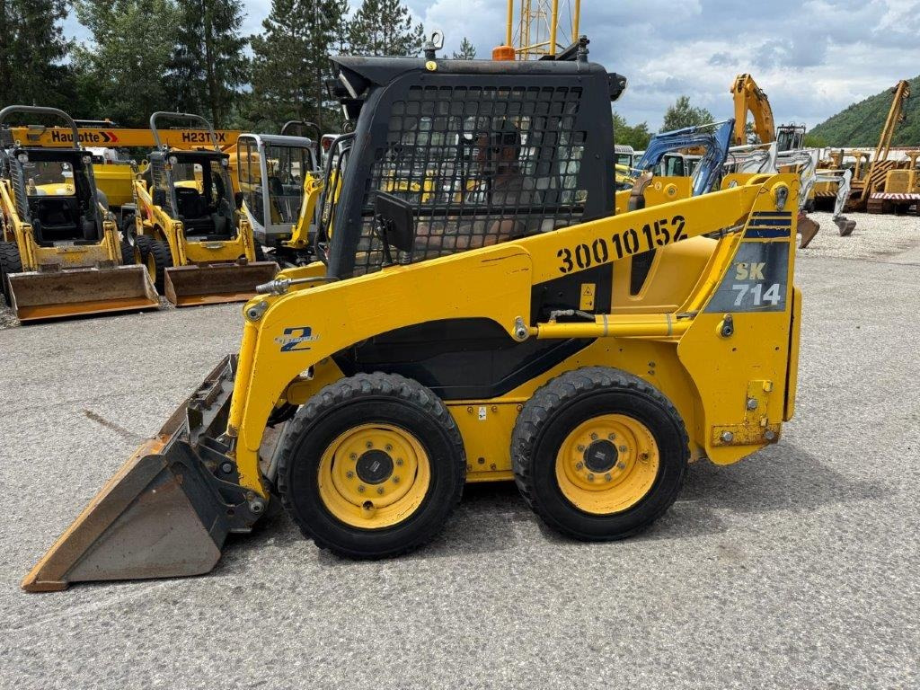 Komatsu SK714-5 (4026) - Smykový nakladač: obrázek 1 Komatsu SK714-5 (4026) - Smykový nakladač: obrázek 1