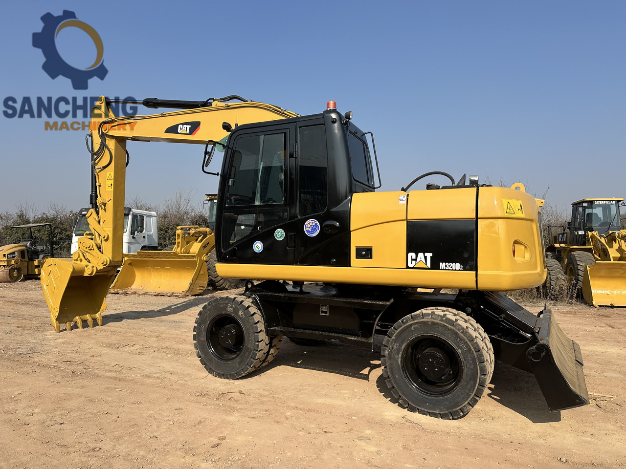 CATERPILLAR M320D2 - Kolesové rýpadlo: obrázek 1 CATERPILLAR M320D2 - Kolesové rýpadlo: obrázek 1