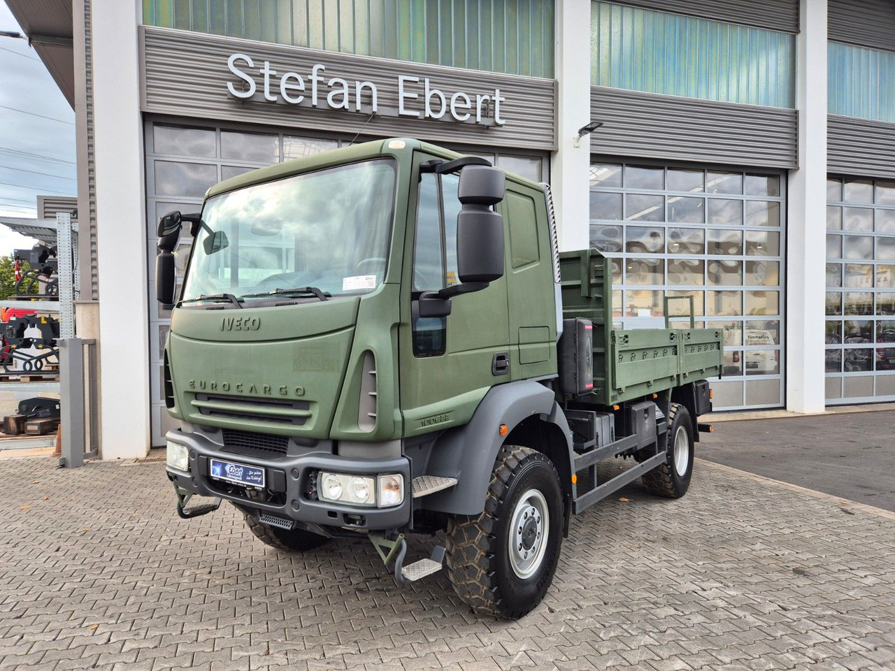 Iveco Eurocargo ML100E22WM-BW 4x4 Pritsche L-Haus Bett - Nákladní automobil valníkový/ Plošinový: obrázek 1 Iveco Eurocargo ML100E22WM-BW 4x4 Pritsche L-Haus Bett - Nákladní automobil valníkový/ Plošinový: obrázek 1