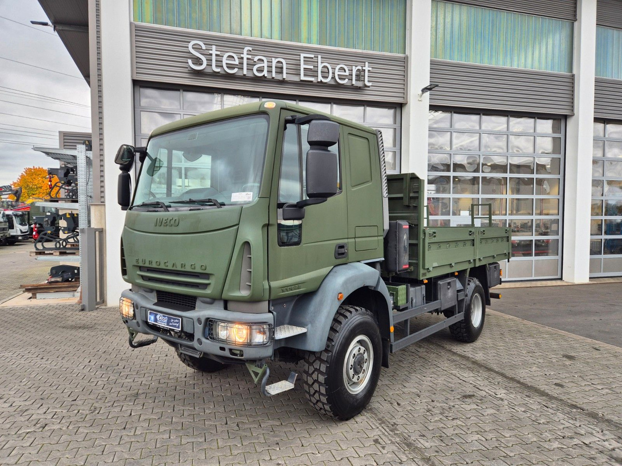 Iveco Eurocargo ML100E22WM-BW 4x4 Pritsche L-Haus Bett - Nákladní automobil valníkový/ Plošinový: obrázek 1 Iveco Eurocargo ML100E22WM-BW 4x4 Pritsche L-Haus Bett - Nákladní automobil valníkový/ Plošinový: obrázek 1