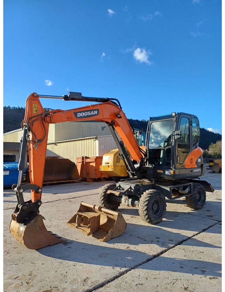 DOOSAN INFRACORE AMERICA CORP. DX57W-7 - Kolesové rýpadlo: obrázek 1 DOOSAN INFRACORE AMERICA CORP. DX57W-7 - Kolesové rýpadlo: obrázek 1